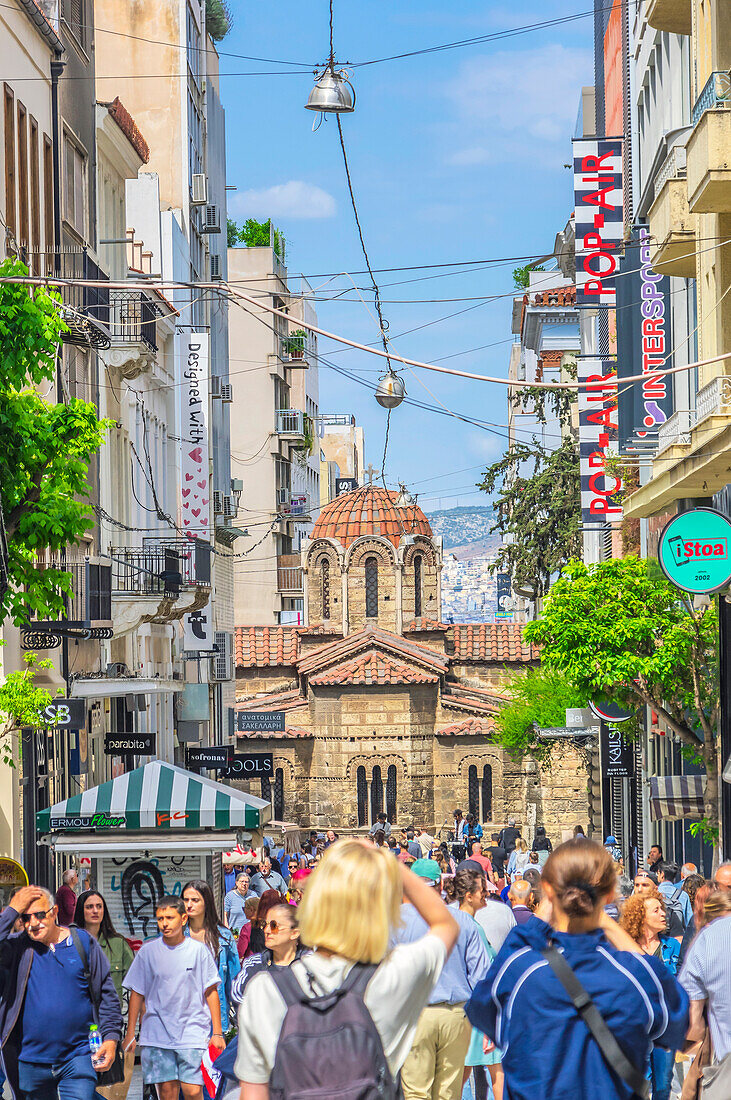  Shopping street in Athens, in the background the Holy University Church 