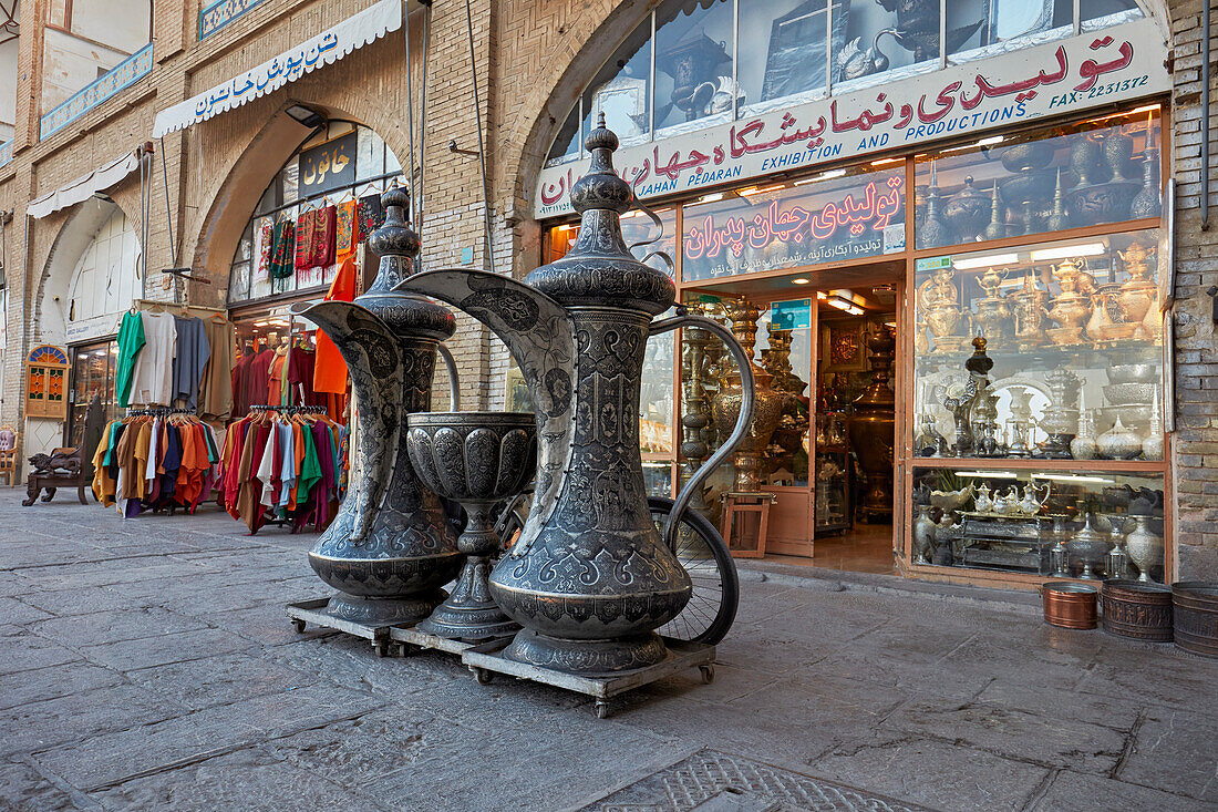 Giant Qalamzani, or Ghalamzani (traditional Iranian metal engraving art) ewers displayed outside of a handicraft shop in Isfahan, Iran.