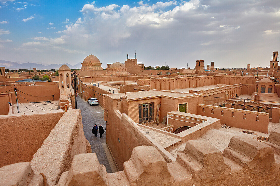 A rooftop view of traditional adobe buildings in historical Fahadan Neighborhood in Yazd, Iran.