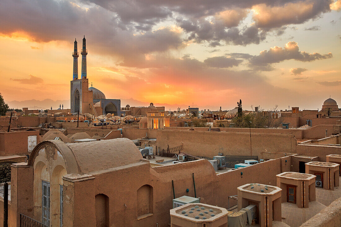 Rooftop view of old adobe buildings in the historical Fahadan Neighborhood at sunset. Yazd, Iran.