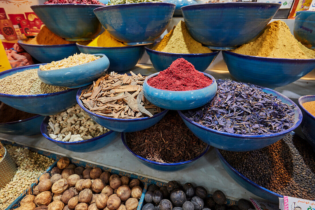 Colorful selection of local spices for sale displayed at the Vakil Bazaar in Shiraz, Iran.