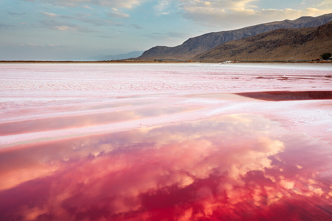 Maharloo Lake, aka the Pink Lake, seasonal potassium rich salt lake, in dry season with vivid pink water. Fars Province, Iran.