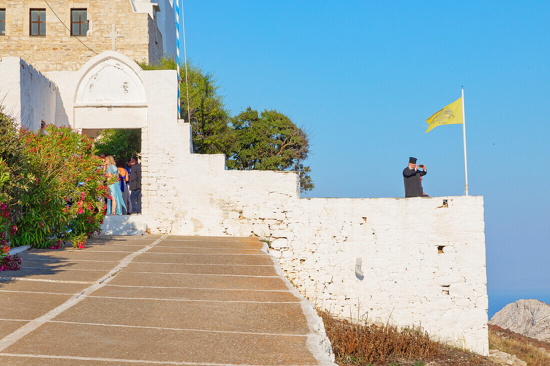 Orthodox priest using his mobile phone, Chora, Folegandros Island, Cyclades Islands, Greece