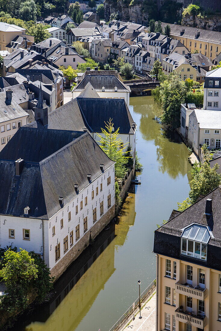  View of buildings in the Grund district in the valley below the center of Luxembourg City on the banks of the Alzette river, Luxembourg, Luxembourg, Europe 