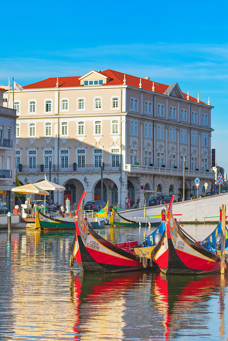 View of moliceiro boats floating on Aveiro river main lagoon, Aveiro, Portugal