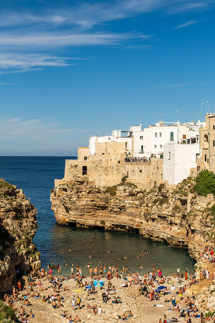 View on Cala Monachile or Lama Monachile from the Roman bridge behind the bay Polignano a Mare, Puglia, Italy.