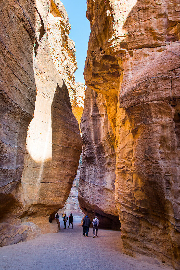 The Siq, narrow gorge leading to the Historic and archaeological Nabataean city of Petra, UNESCO World Heritage Site, Jordan, Near East, Southern Levant, West Asia