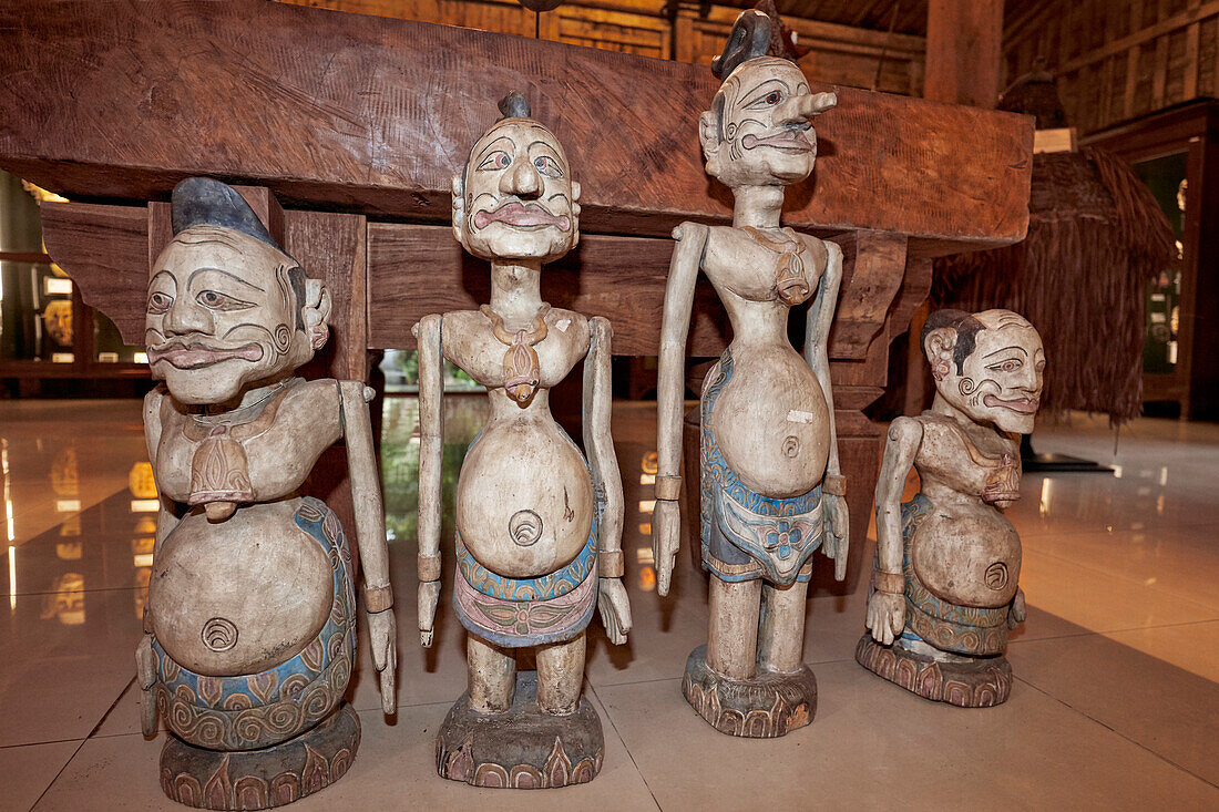 Wooden figures displayed in the Setia Darma House of Masks and Puppets. Mas, Ubud, Bali, Indonesia.