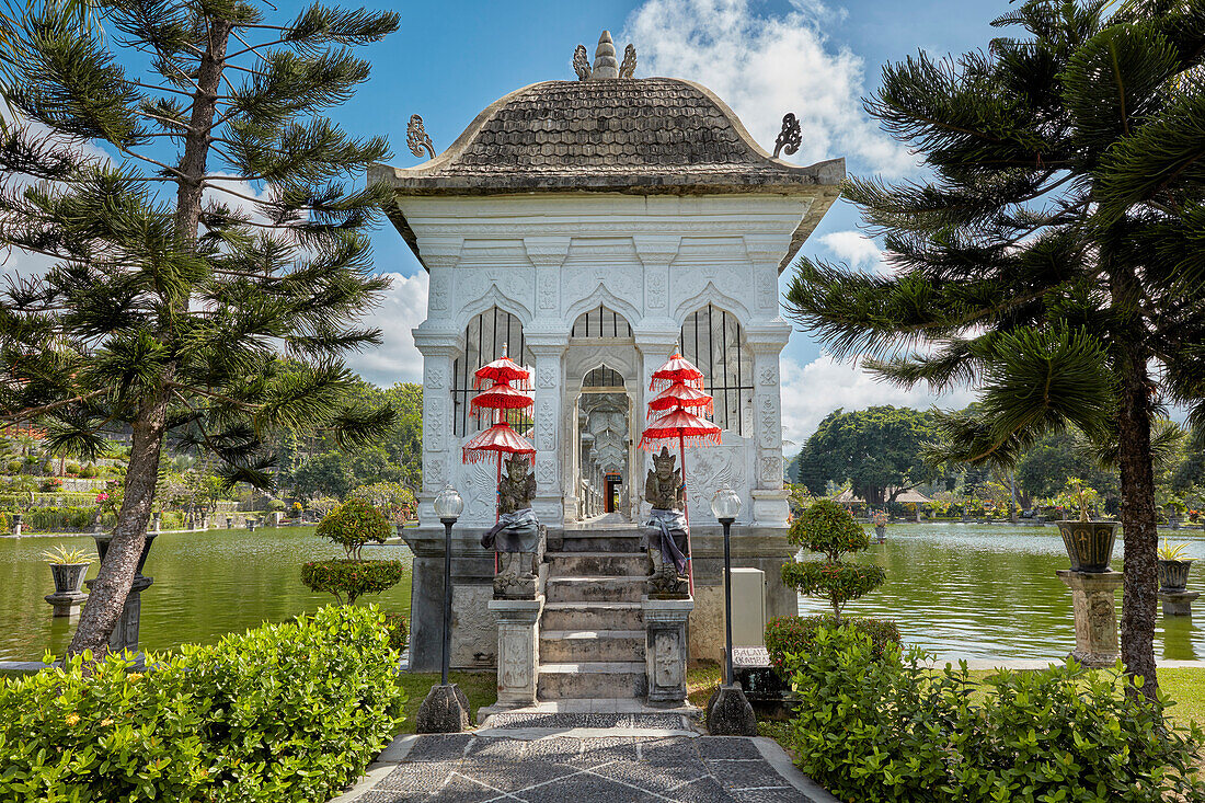 Entrance to the walking bridge leading to the Gili Bale, main building of the Ujung Water Palace (Taman Ujung). Karangasem Regency, Bali, Indonesia.