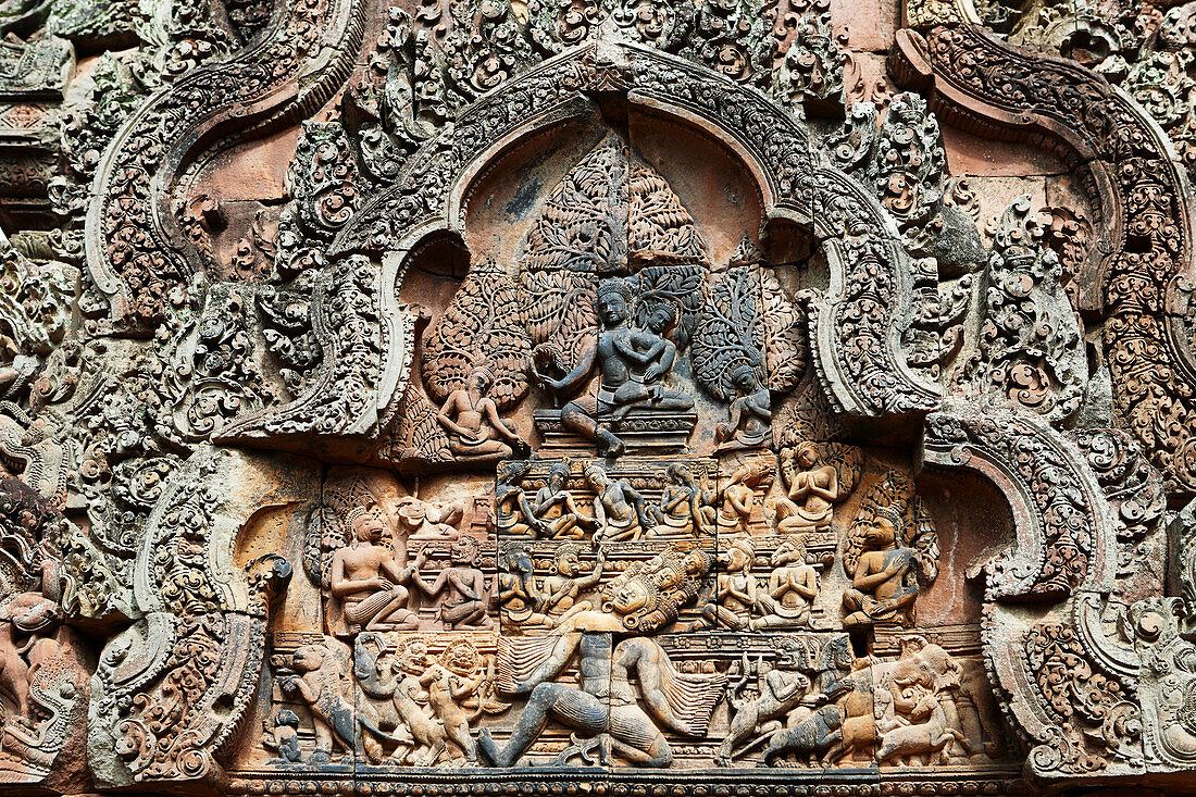 Close up view of stone carvings in the ancient Banteay Srei temple. Angkor Archaeological Park, Siem Reap Province, Cambodia.