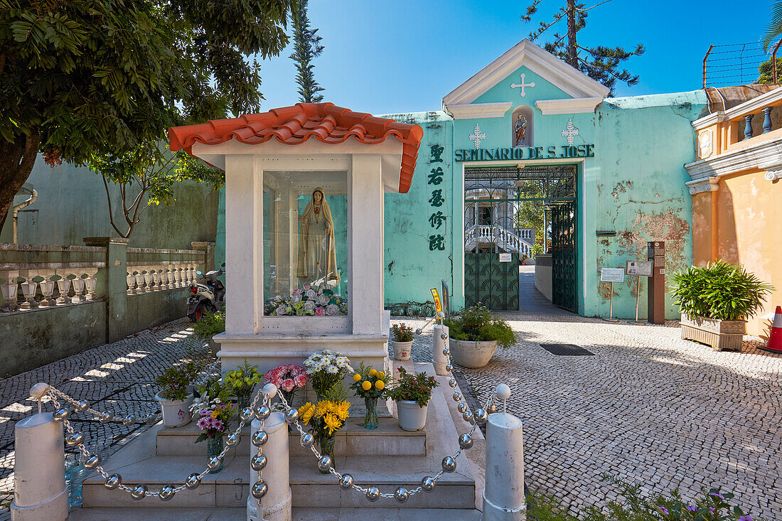 Small chapel with the statue of the Our Lady at the entrance to St. Joseph Seminary. Macau, China.