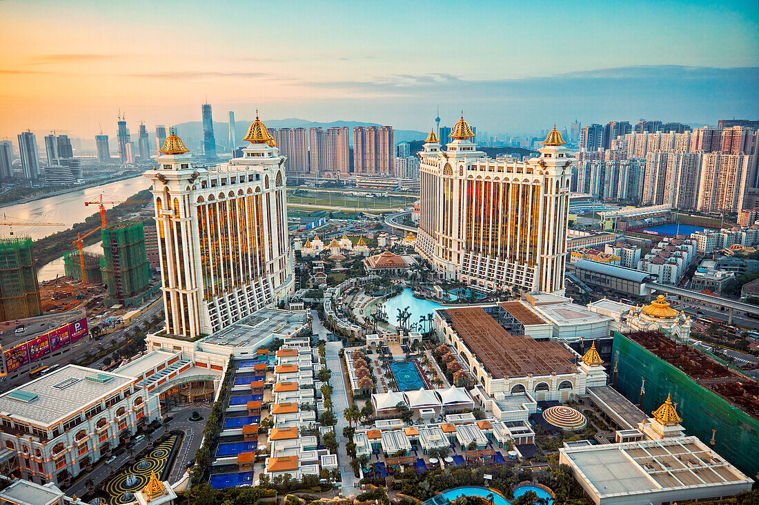 Aerial view of the Galaxy Macau Hotel, a luxurious resort complex, at dusk. Cotai, Macau, China.