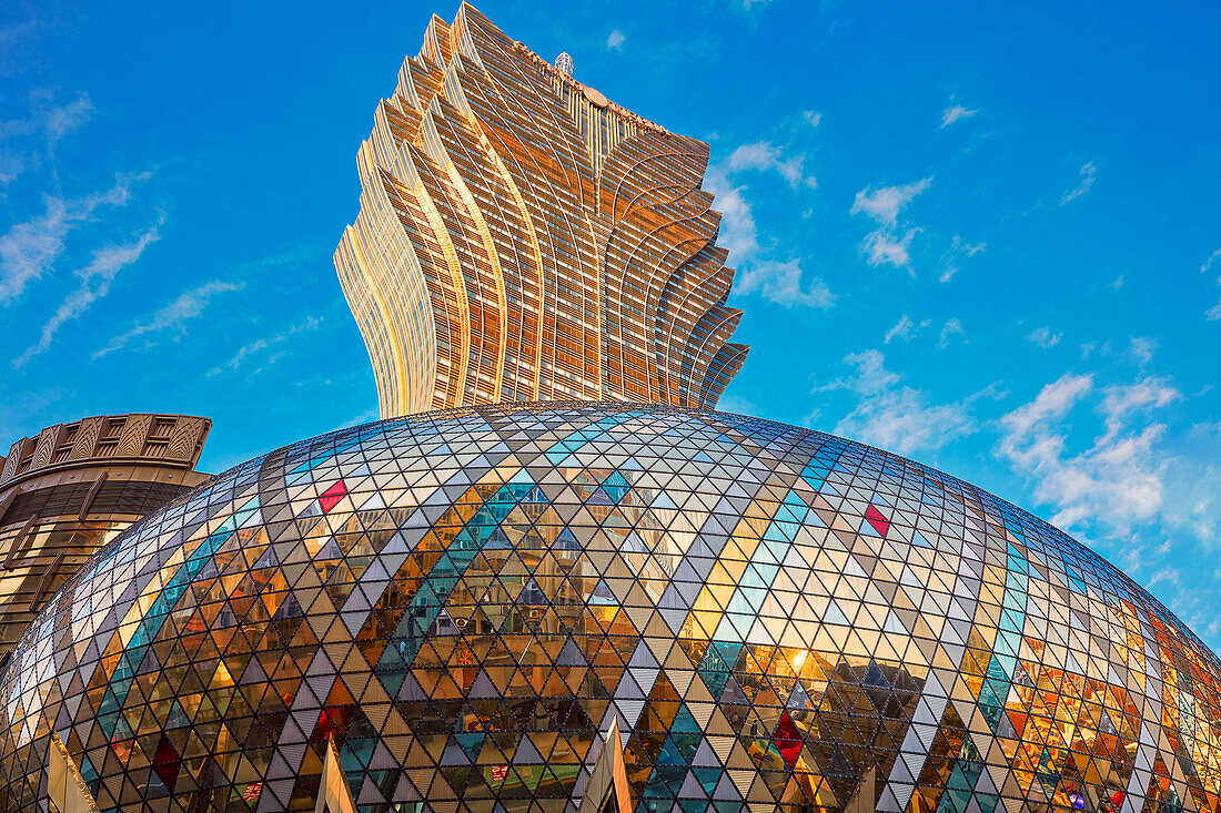 Exterior view of the shiny golden dome of the Hotel Grand Lisboa. Macau, China.