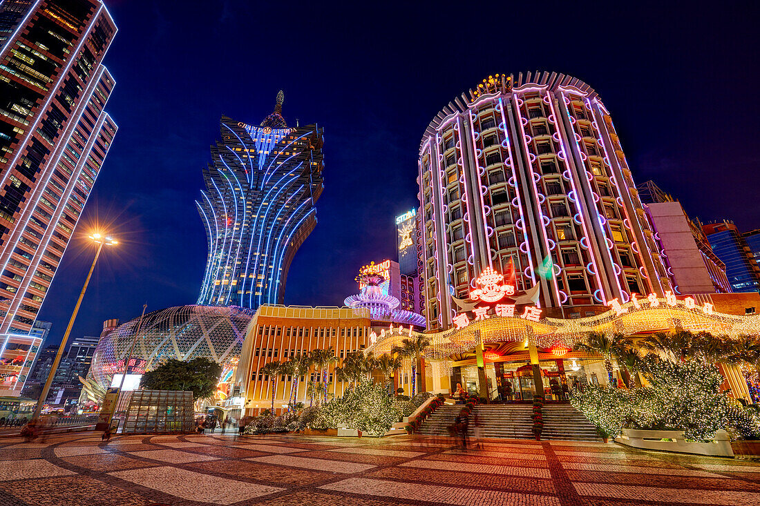 Hotels Lisboa and Grand Lisboa illuminated at night. Macau, China.