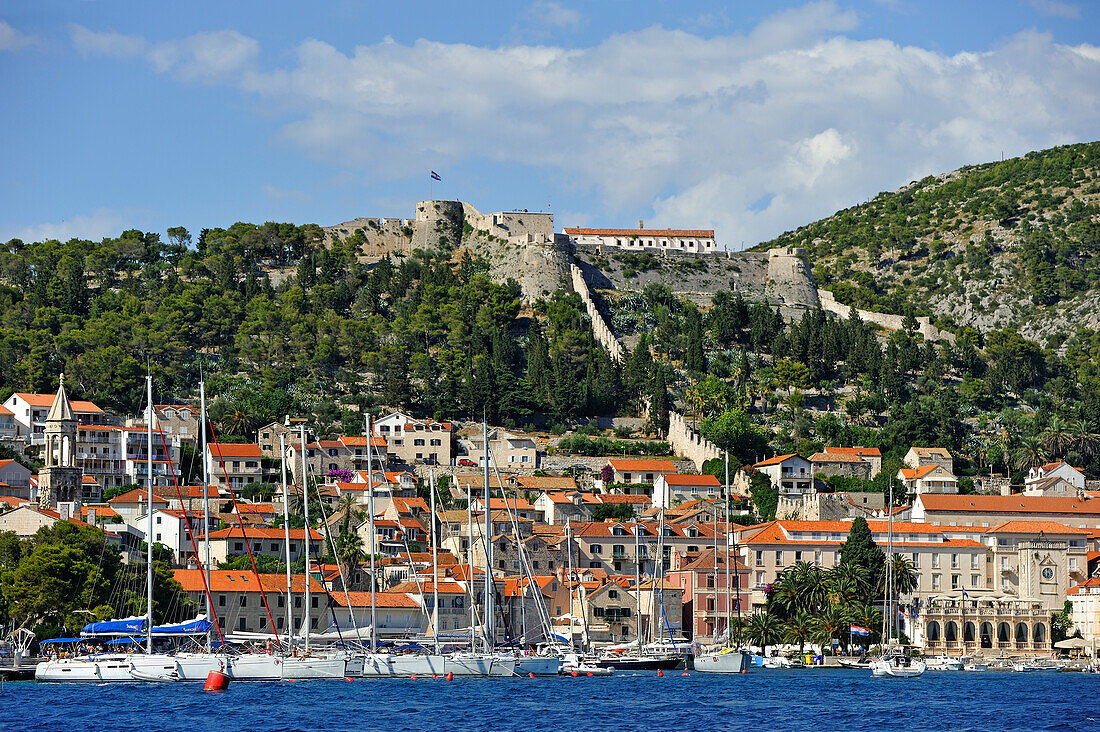 Spanish fortress above Hvar city seen from the sea, Hvar island, Croatia, Southeast Europe