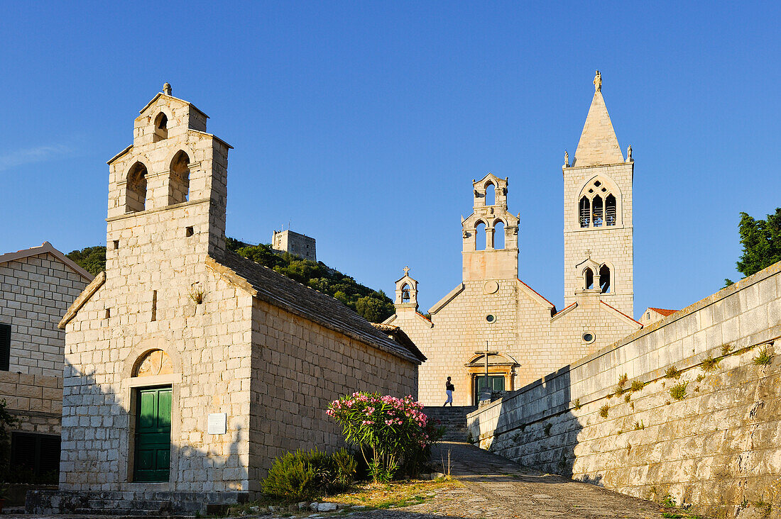 church of Saint Blaise (12th century) in front of the church of Saint Cosmas and Saint Damian (14th century), Lastovo town, Lastovo island, Croatia, Southeast Europe