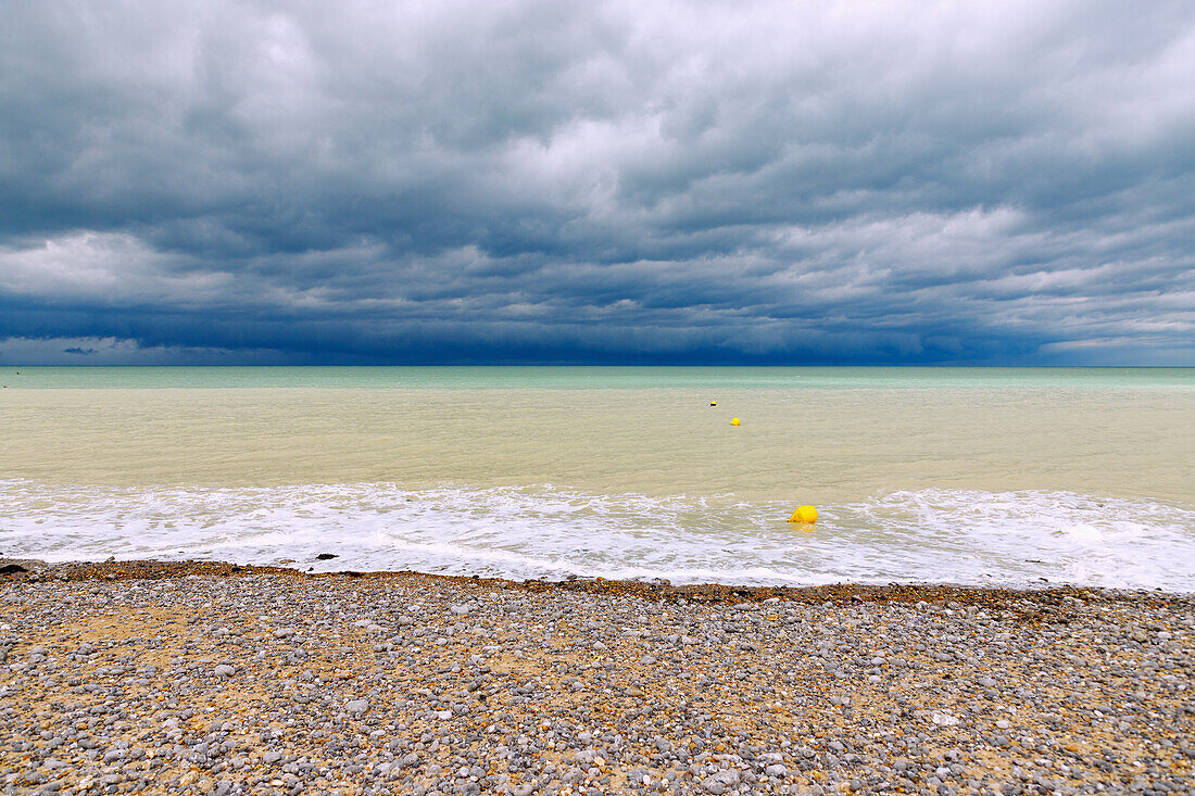  Storm clouds over the sea on the pebble beach in Dieppe on the Alabaster Coast (Côte d&#39;Albâtre, Cote d&#39;Albatre) in the Seine-Maritime department in the Normandy region of France 