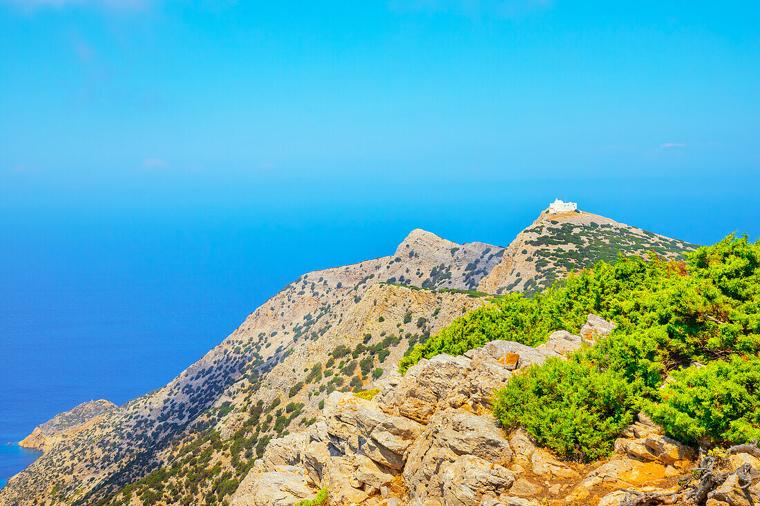 View of Prophet Elias Monastery perched on the top of Sifnos Island northern coast, Sifnos Island, Cyclades Islands, Greece