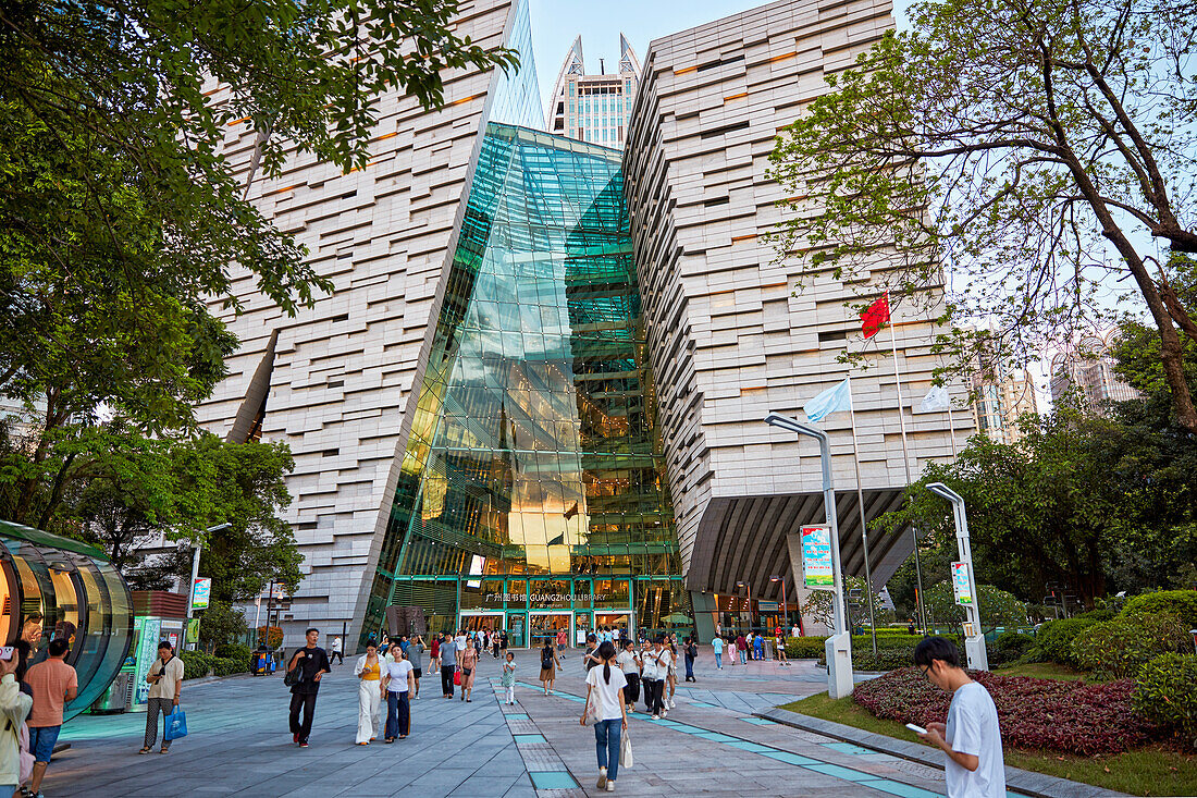 People walk at the entrance to the Guangzhou Library. Guangzhou, Guangdong Province, China.