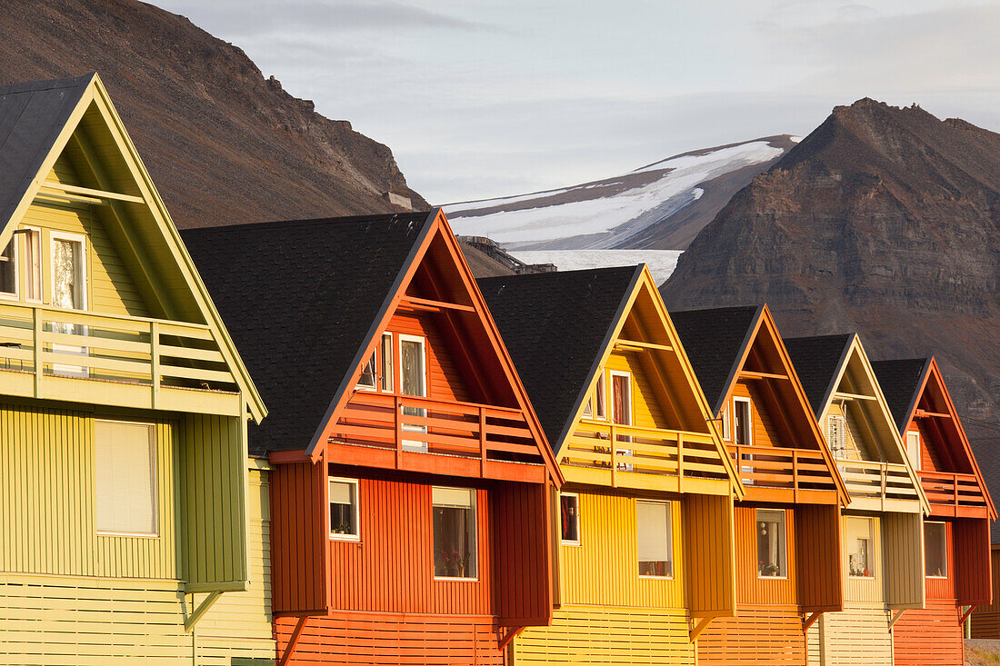  Colorful wooden houses in Longyearbyen in the midnight sun, summer, Spitsbergen, Norway 