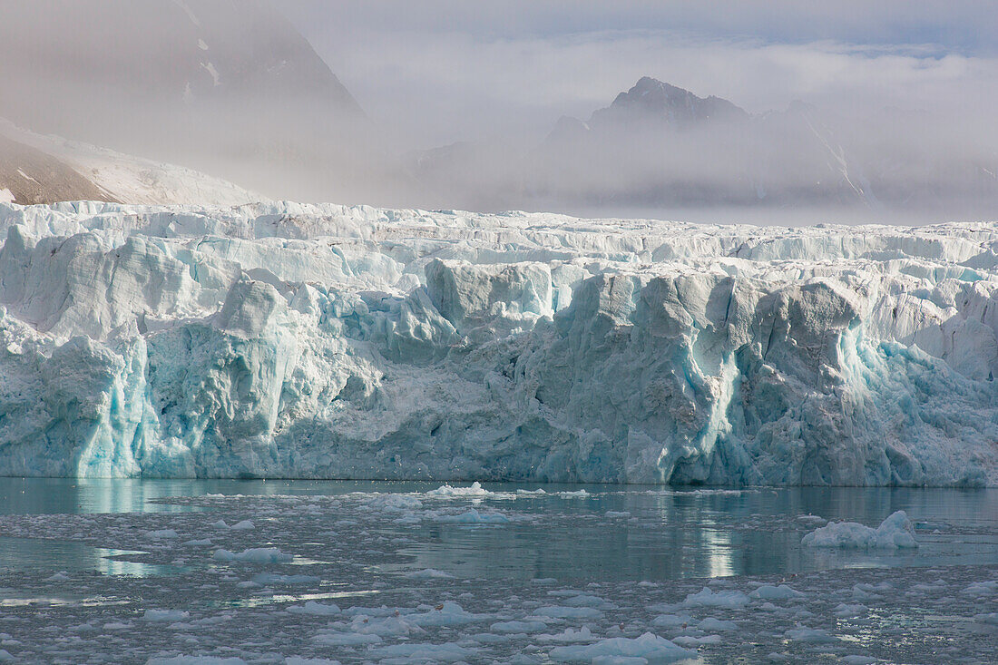  Fog over the glacier Waggonwaybreen, Magdalenefjord, Spitsbergen, Norway 