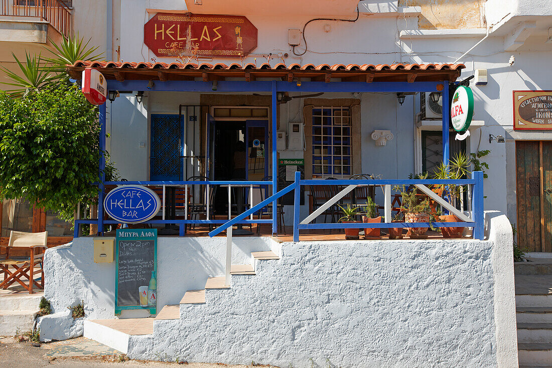 Exterior view of a small Greek cafe. Elounda village, Crete, Greece.