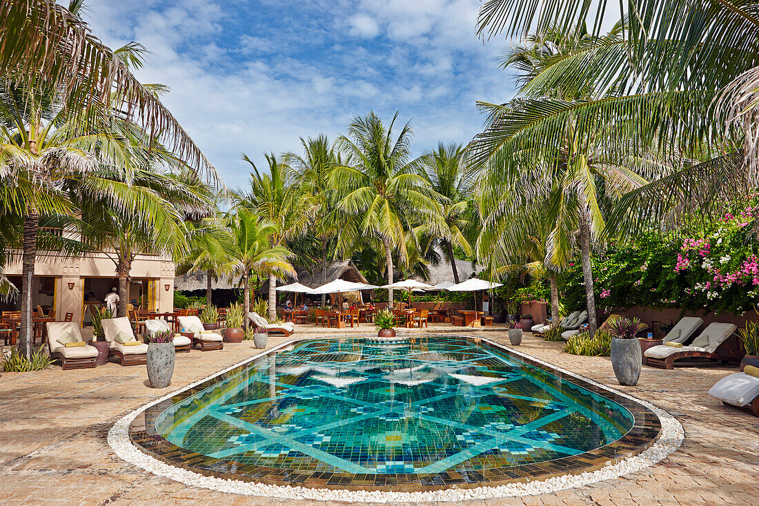 Buildings and the pool area of luxurious Mia Resort Mui Ne. Mui Ne Beach, Binh Thuan Province, Vietnam.