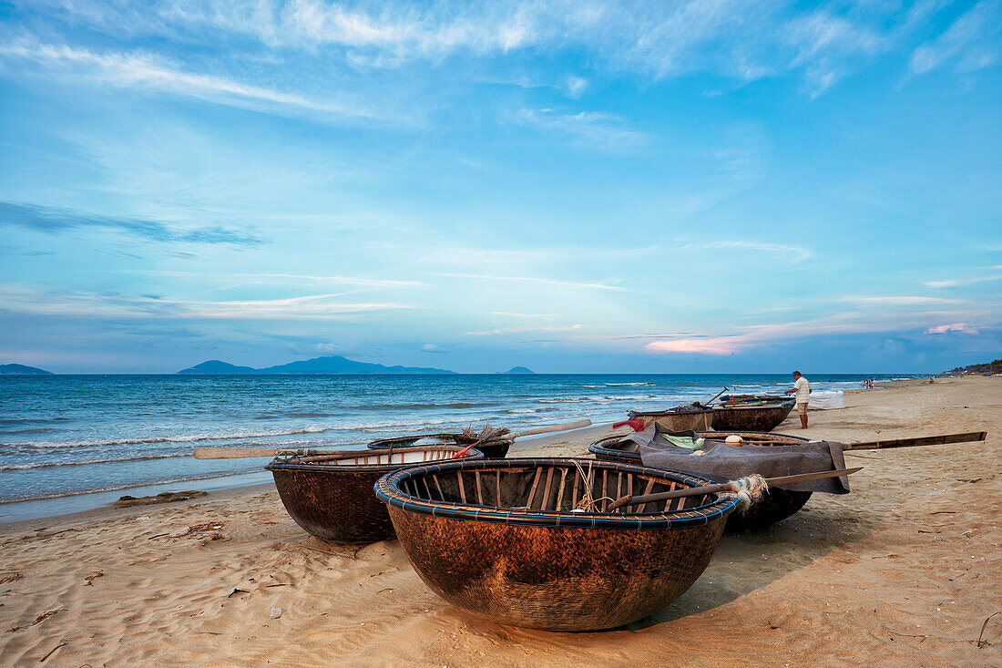 Traditional Vietnamese coracles on Cua Dai Beach. Hoi An, Quang Nam Province, Vietnam.