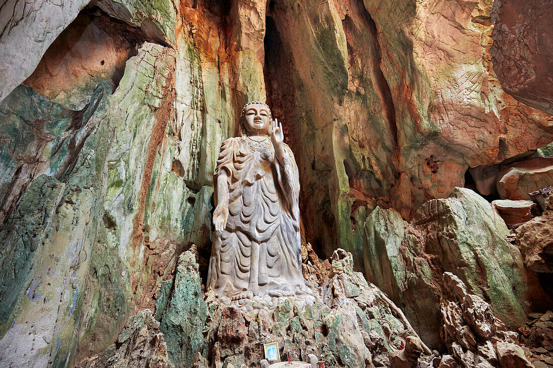 The Upright Buddha statue in Tang Chon Cave. Thuy Son Mountain, The Marble Mountains, Da Nang, Vietnam.