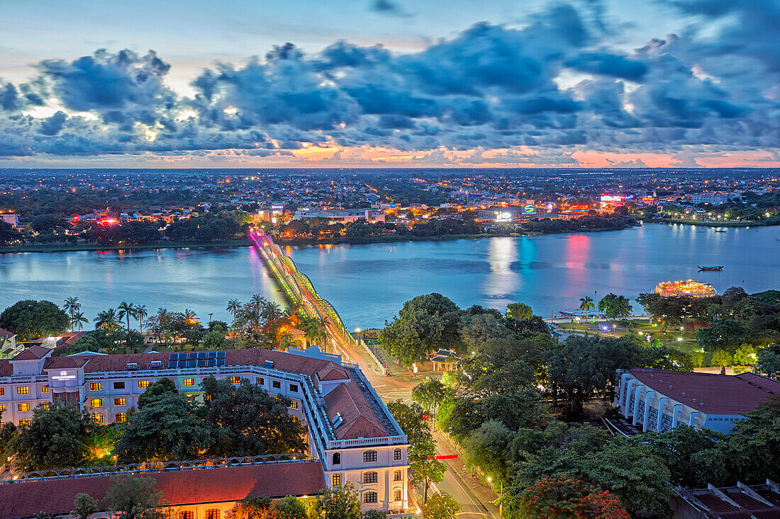 Low aerial view of the Perfume River and Hue city at dusk. Hue, Vietnam.