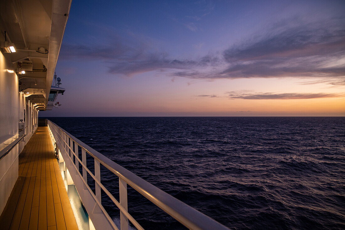  Deck of the expedition cruise ship SH Diana (Swan Hellenic) at sunset at sea, near Madagascar, Indian Ocean 