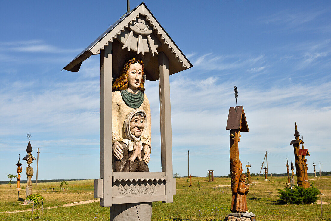 sculptures of angels made of oak wood on the Hill of Angels, marking the Millenium of the Lithuania's name and 600-years anniversary of the Trakai Church of the Visitation of \nthe Blessed Virgin Mary, near Trakai, Lithuania, Europe