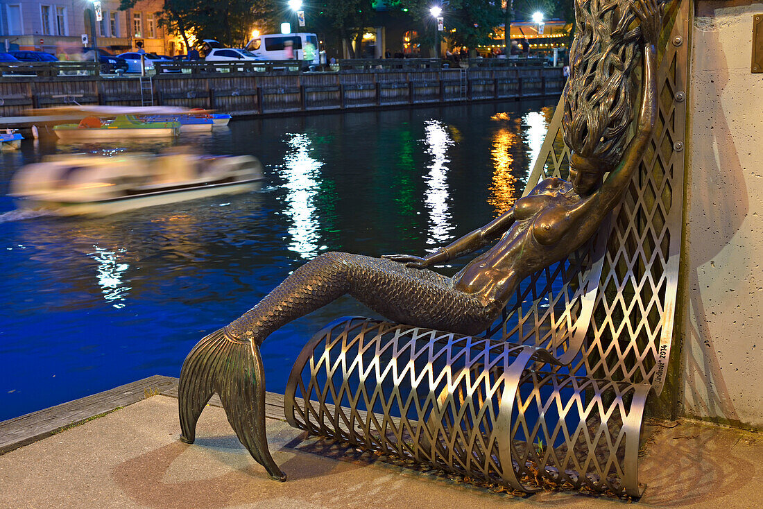 Siren’s bench on the embankment of the Dane River, old harbour of Klaipeda, port city on the Baltic Sea, Lithuania, Europe