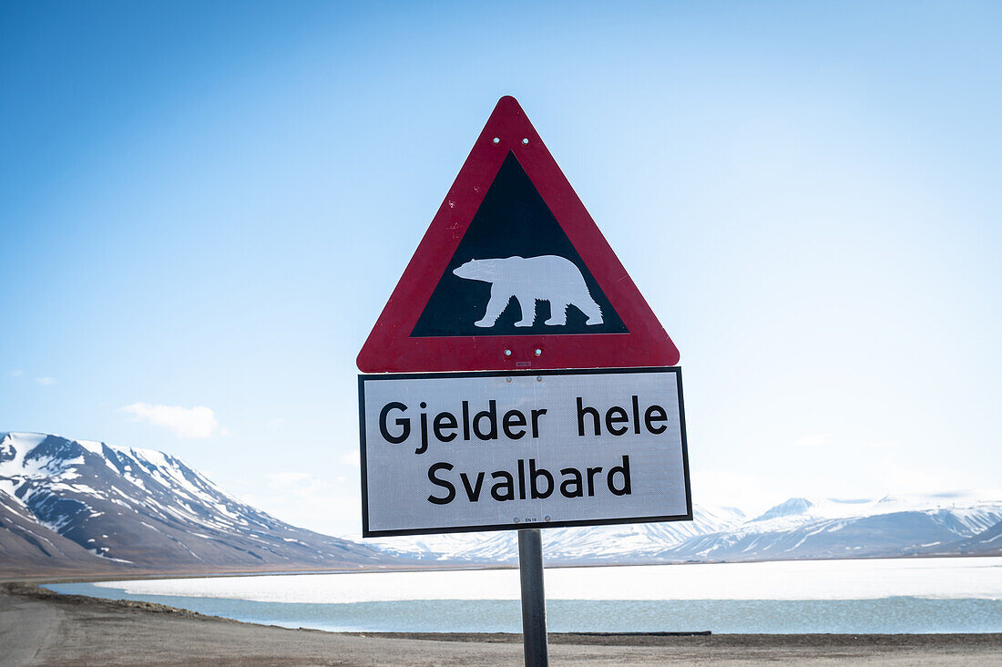  Polar bear warning sign, sign at the exit of Longyearbyen. Behind this sign you are only allowed to walk with a guide with a gun, Spitsbergen, Svalbard, Norway, Akrtis 