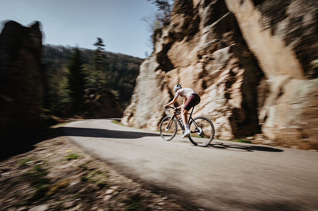 Road biking, woman riding a racing bike on the road