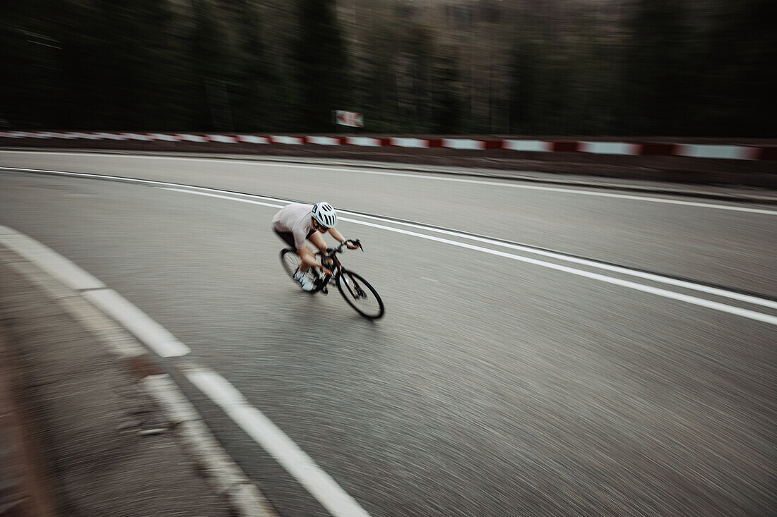 Road biking, woman riding a racing bike on the road