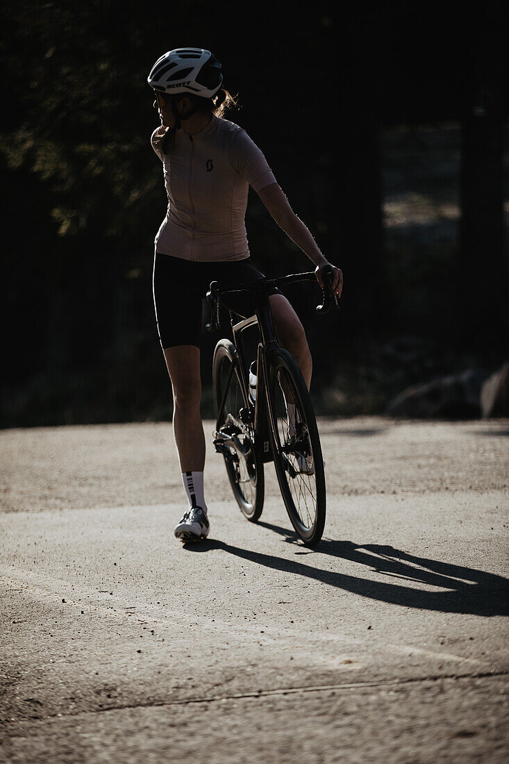 Road biking, woman riding a racing bike on the road