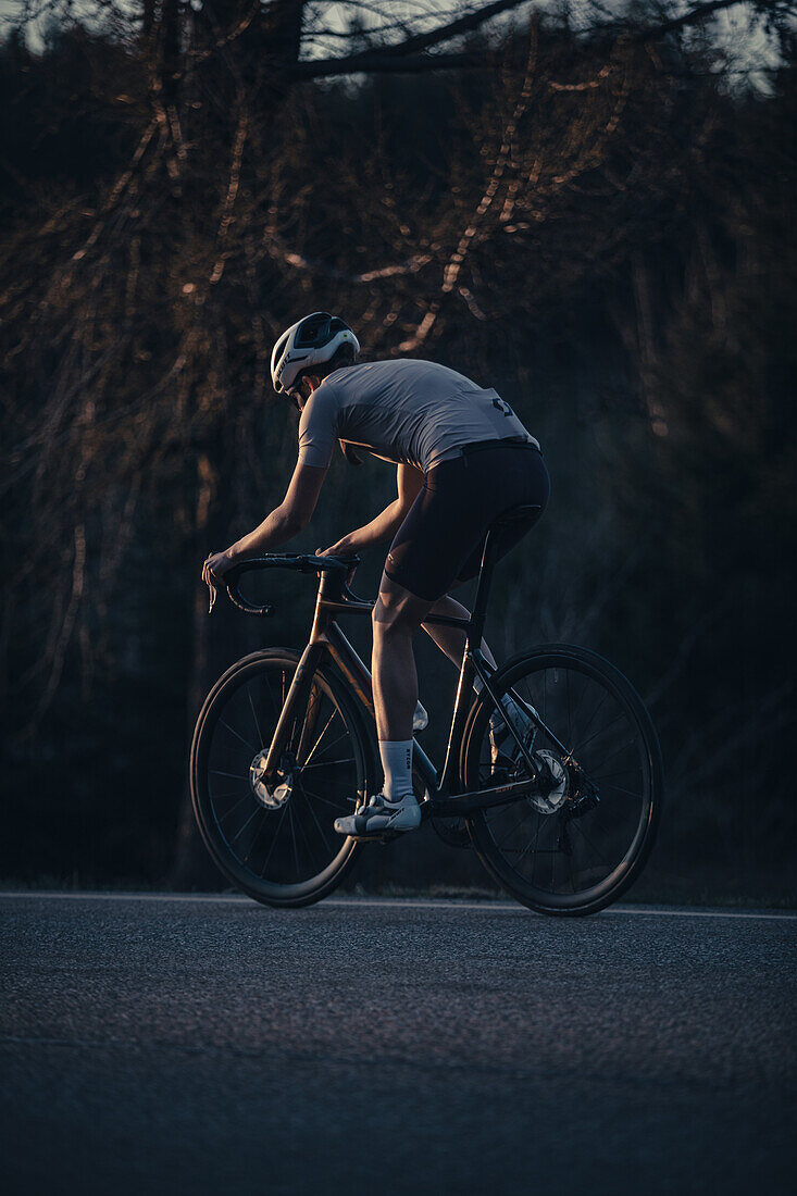 Road biking, woman riding a racing bike on the road