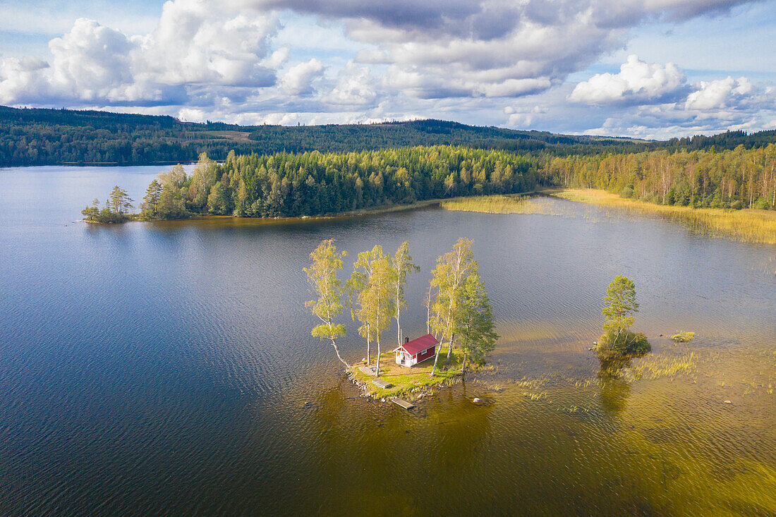  Lonely cabin on a small island in the lake, Vaermland, Sweden 