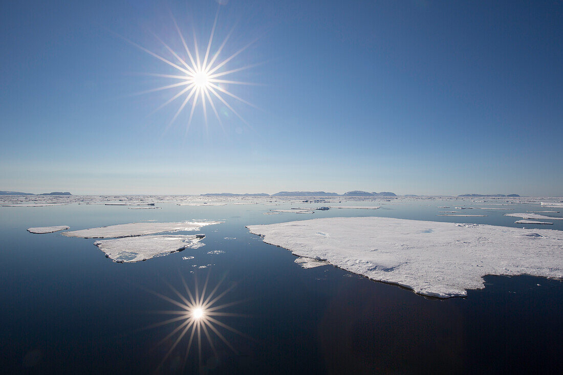  Midnight sun in the Arctic Ocean, Nordaustland, Spitsbergen, Norway 