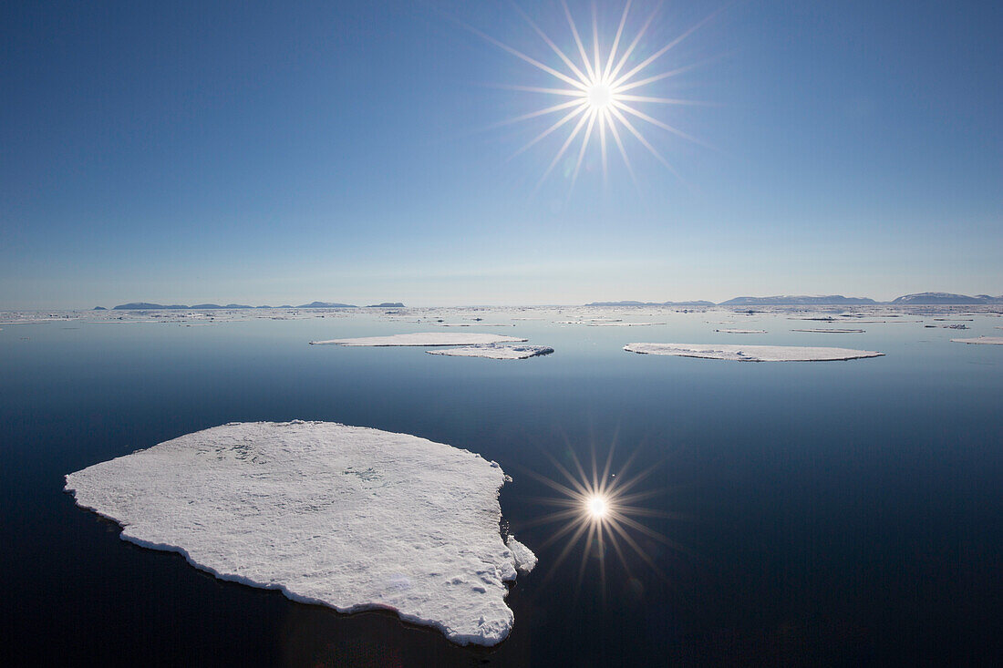  Midnight sun in the Arctic Ocean, Nordaustland, Spitsbergen, Norway 