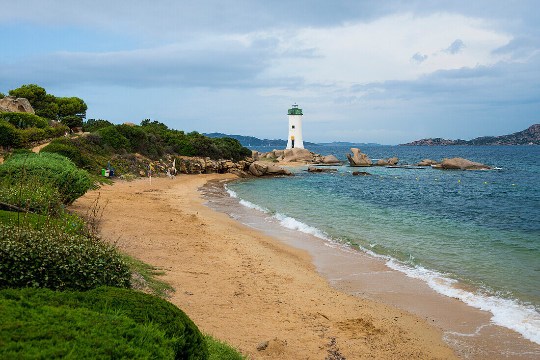  Lighthouse with beach and bizarre granite rocks, Spiaggia Porto Faro, Faro di Punta Palau, Palau, Costa Smeralda, Sardinia, Italy 