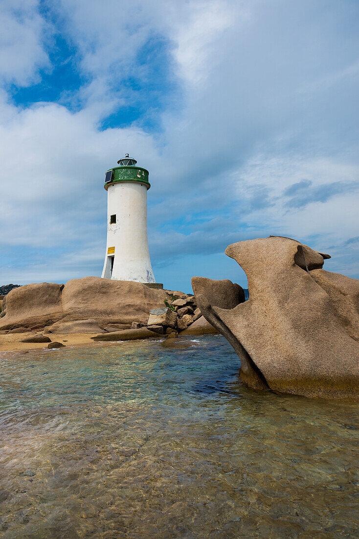  Lighthouse with beach and bizarre granite rocks, Spiaggia Porto Faro, Faro di Punta Palau, Palau, Costa Smeralda, Sardinia, Italy 