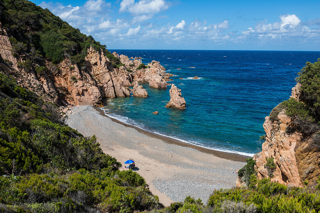  Red rocks and lonely beach, Spiaggia di Tinnari, Costa Paradiso, Sardinia, Italy 