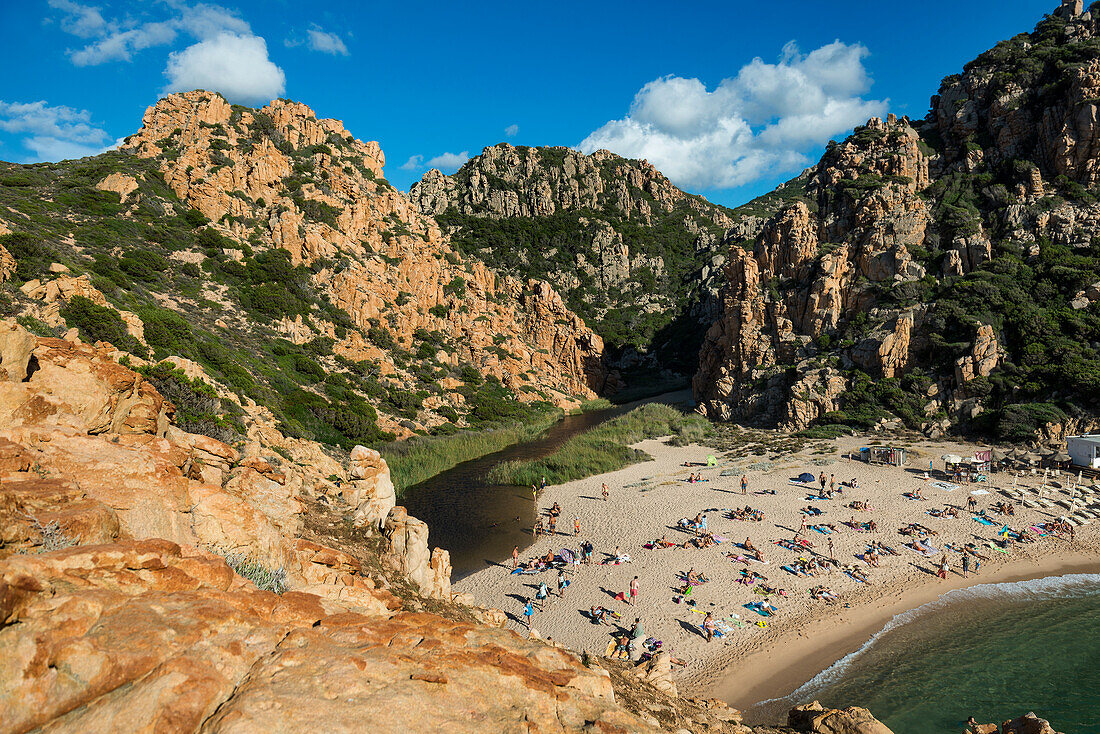  Red rocks and picturesque beach, Spiaggia di Cala li Cossi, Costa Paradiso, Sardinia, Italy 