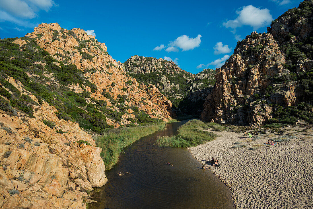  Red rocks and picturesque beach, Spiaggia di Cala li Cossi, Costa Paradiso, Sardinia, Italy 