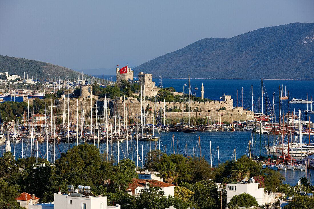 Scenic view of the Bodrum Castle and Bodrum Marina with many moored boats. Bodrum city, Mugla province, Turkey.