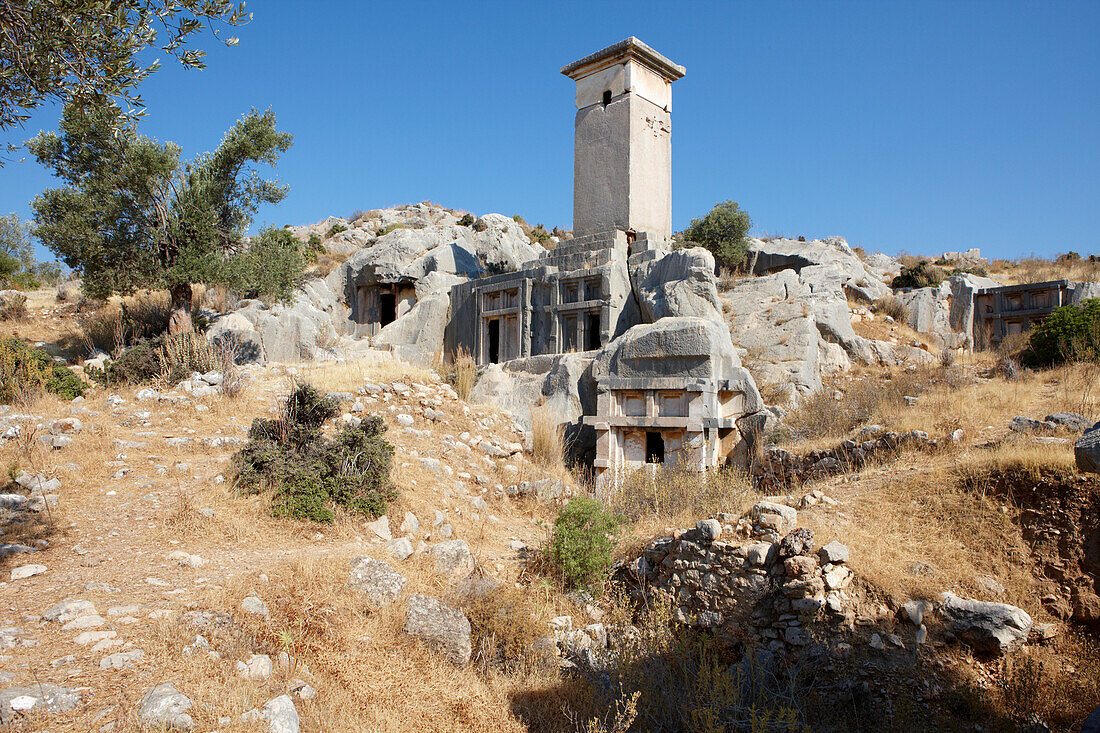 Typical Lycian pillar tomb and house type rock-cut tombs in Xanthos, an ancient Lycian city in the South West of modern Turkey.