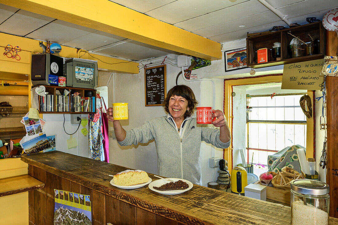  Landlady of the Rifugio Rosazza hut serves two cups of coffee, Rifugio Rosazza, GTA, Grande Traversée des Alpes, Biella, Alpi Biellesi, Valais Alps, Piedmont, Italy 