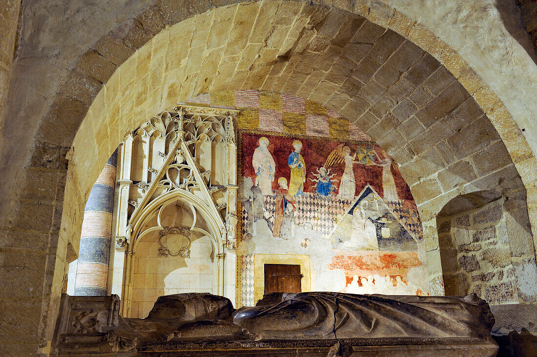 Recumbent effigy of Bishop Henri de Severy with in background mural painting from early 15th century on the north wall of the Choir,Church of Romainmotier Priory,Canton of Vaud,Switzerland,Europe